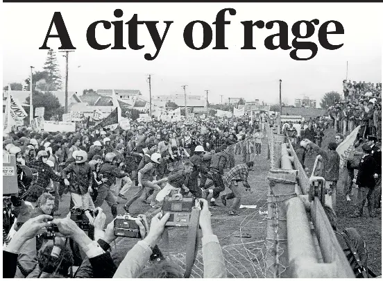  ?? STUFF ?? Springbok tour protesters storm Hamilton’s Rugby Park on July 25, 1981, forcing the match between the South Africans and Waikato to be abandoned. Opposition to the tour raged throughout the country but the Hamilton fixture was the only one called off.