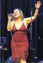  ?? ADOLPHE PIERRE-LOUIS/JOURNAL ?? Besides being a project manager at HB Constructi­on, Jackie Zamora is the lead singer in five local bands, including the popular Baracutang­a.