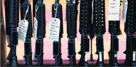  ?? DOMINICK REUTER/AFP/GETTY IMAGES FILES ?? The slick ads by major gun makers are typically big drivers of sales ahead of Black Friday. Gun-control activists are raising alarm over the potential of such ads to inspire the next shooter, while gun-rights advocates say the problem is deranged...