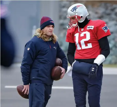  ?? NANCY LANE / BOSTON HERALD ?? COACHING HIM UP: Tom Brady chats with safeties coach Steve Belichick during practice yesterday as the Patriots prepare to host the Chargers in Sunday’s AFC divisional playoff game.