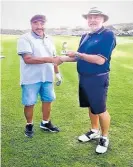  ??  ?? Tiki Bluegum receiving his Hole in One trophy from Allan Thomson.