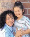  ?? RICK NATHANSON/JOURNAL ?? Zoey Perea, with her mother Tenesha, is all smiles after learning she was returning to school.