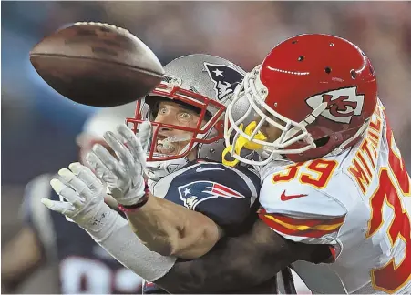  ?? STAFF PHOTO BY MATT STONE ?? ROUGH NIGHT: Chiefs cornerback Jacoby Glenn knocks the ball away from Patriots running back Rex Burkhead during the Pats’ season-opening loss last night in Foxboro.