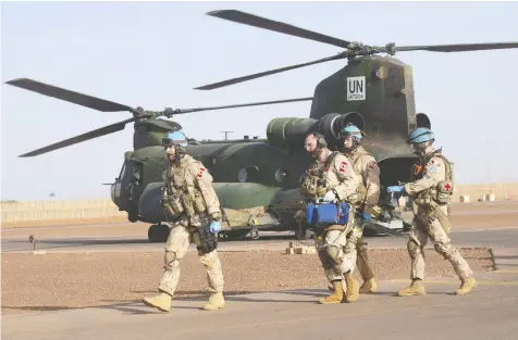  ?? ADRIAN WYLD / THE CANADIAN PRESS ?? Canadian medics take part in a demonstrat­ion on the UN base in Gao, Mali, in 2018. The Canadian military is being asked to again provide aid to
Mali amid concerns instabilit­y there will spill over into the surroundin­g region, providing a potential base of operations for terrorist groups.