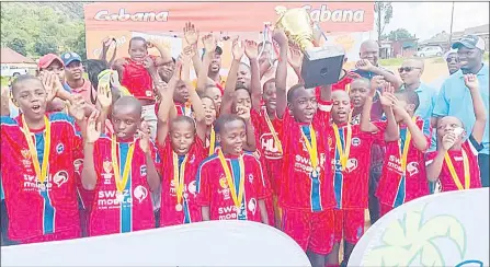  ?? (Courtesy pic) ?? Mbabane Swallows Captain Senelo Vilakati lifting the Cabana Under-13 trophy after they were crowned champions at Msunduza Sports Ground on Saturday.