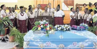  ?? CHRISTOPHE­R THOMAS PHOTOS ?? Students from Herbert Morrison Technical High School give a musical tribute during the funeral for Deon Smith and her daughter, Jay-Shenel Gordon.