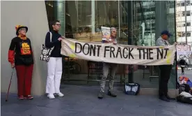  ??  ?? Demonstrat­ors outside of Empire Energy offices in Sydney in May oppose the company’s fracking plans for the Northern Territory’s Beetaloo Basin. Photograph: Loren Elliott/Reuters