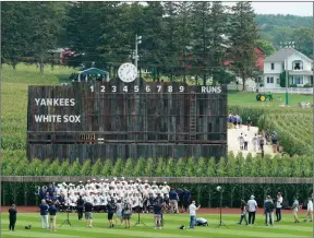  ?? The Associated Press ?? Chicago White Sox players pose a team photo before a baseball game against the New York Yankees in the cornfields of Iowa last year. The second “Field of Dreams” game is Thursday night.