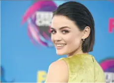  ?? JORDAN STRAUSS/INVISION/THE ASSOCIATED PRESS ?? Lucy Hale arrives at the Teen Choice Awards last month in Los Angeles with her hair cut short and swept back. Above-the-shoulder cuts are making a comeback.