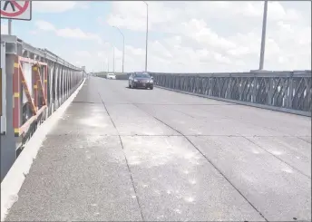  ??  ?? Cars moving along the Berbice River Bridge on Monday