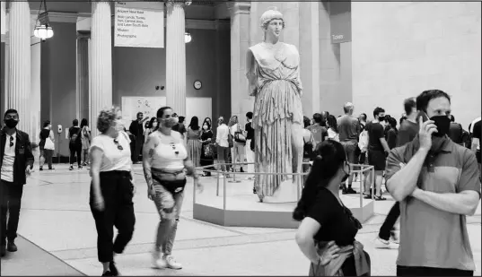  ?? GEORGE ETHEREDGE / THE NEW YORK TIMES ?? Masked patrons visit the The Metropolit­an Museum of Art on July 10 in New York. With daily reports of breakthrou­gh COVID infections and the rise of the Delta variant, vaccinated people may need to take a few more precaution­s.