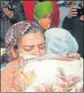  ?? HT ?? One of the women reuniting with her family member at Amritsar airport on Friday.