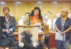  ?? DAVE MATHIESON/AMHERST NEWS ?? The Ruddick sisters — Leah, left, Valerie and Sylvia — sing a song written by their father Maurice Ruddick during a hymn sing and memorial at St. Andrew’sWesley United Church in Springhill on Oct. 23 marking the 60th anniversar­y of the disaster.