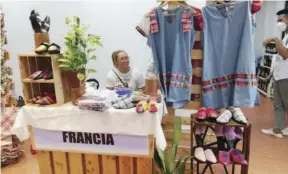  ?? ?? Dresses and shoes with “patadyong” or the handwoven fabric made in Antique are displayed at a recent trade and tourism fair.