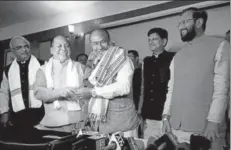 ?? PTI ?? Nongthomba­m Biren Singh (centre) is greeted after being elected the BJP’s legislatur­e party leader, Imphal, March 13