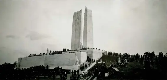  ??  ?? Thousands of people inspect the Vimy monument following its unveiling in 1936.