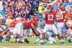  ?? VASHA HUNT/ASSOCIATED PRESS ?? Alabama quarterbac­k Tua Tagovailoa (13) throws a pass against Ole Miss during the first half on Sunday. Tagovailoa helped the Crimson Tide move to No. 1 in the AP poll.