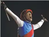  ?? MARTIN DOKOUPIL AP ?? Country Grammer’s jockey Frankie Dettori reacts after winning Grade I Dubai World Cup.