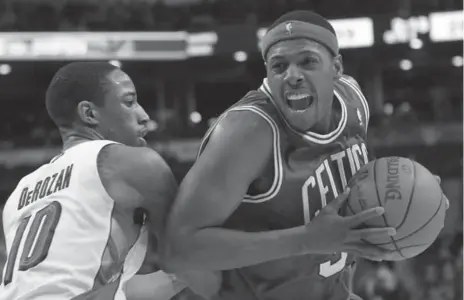  ?? RENE JOHNSTON/TORONTO STAR ?? Toronto’s Demar Derozan, left, defends against hard-charging Celtic Paul Pierce during the first half Friday night at the Air Canada Centre.