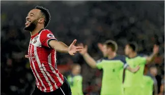  ??  ?? Nathan Redmond celebrates after scoring his goal against Liverpool.
