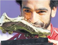  ?? MICHAEL REGAN/GETTY IMAGES ?? Liverpool’s Mohamed Salah receives his Premier League Golden Boot Award after finishing with a record-setting 32 goals.