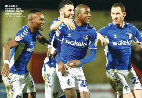  ?? PICTURE: MI News & Sport ?? ALL-SMILES: Mohamed Sylla celebrates scoring Oldham’s winner