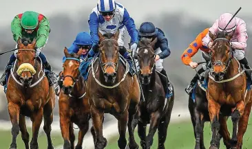  ?? SPORTSFILE ?? In the clear: Chris Hayes rides Lemista (centre) to victory at Naas yesterday