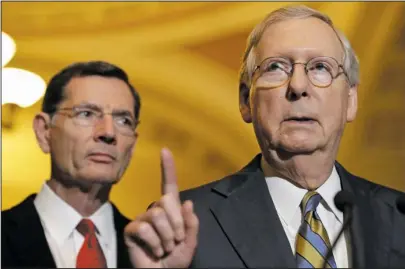  ?? The Associated Press ?? HEALTH CARE BILL: Senate Majority Leader Mitch McConnell of Ky., right, accompanie­d by Sen. John Barrasso, R-Wyo., meets with reporters Tuesday on Capitol Hill in Washington following after a Republican policy luncheon.