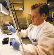  ?? Al Seib Los Angeles Times ?? BRIAN BOWLAND, senior clinical lab specialist in microbiolo­gy at UCLA Health, works on a master mix for testing to detect infection by the coronaviru­s.