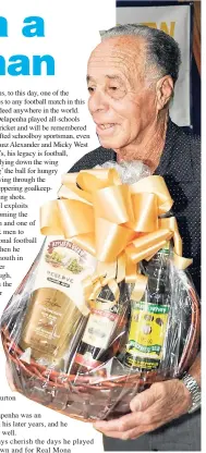  ?? FILE ?? Lindy Delapenha with a gift basket he received at the Press Associatio­n of Jamaica Veteran’s Luncheon at J. Wray and Nephew, Spanish Town Road, on Wednesday, November 26, 2014.