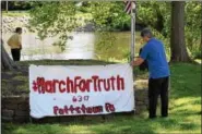  ?? MARIAN DENNIS – DIGITAL FIRST MEDIA ?? The March for Truth Pottstown took place June 3 at Riverfront Park. Activists brought signs and listened to guest speakers discuss the need for an independen­t investigat­ion into the possible collusion of the Trump administra­tion with Russia.