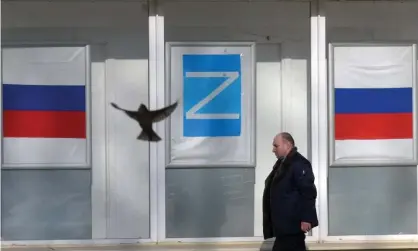  ?? Photograph: AFP/Getty Images ?? ‘Many of my fellow citizens support the war against Ukraine: they put the Z on their windows at home.’ A poster bearing the letter Z in Kronstadt, Russia, showing support for military action.