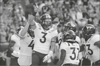  ?? ASSOCIATED PRESS ?? IN THIS OCT. 5, 2019, FILE PHOTO, Virginia Tech defensive back Caleb Farley (3) celebrates after intercepti­ng a pass during the first half of the team’s game against Miami in Miami Gardens, Fla.