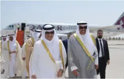  ??  ?? First Deputy Premier and Foreign Minister Sheikh Sabah Al-Khaled Al-Hamad AlSabah welcomes Qatari Foreign Minister Sheikh Mohammad Bin Abdulrahma­n AlThani upon his arrival to Kuwait yesterday.