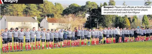  ??  ?? Respect Players and officials at Strathendr­ick observe a minute’s silence for former player, ex-president and coach Ken Kilgour