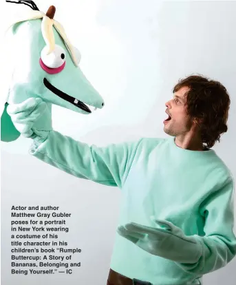  ??  ?? Actor and author Matthew Gray Gubler poses for a portrait in New York wearing a costume of his title character in his children’s book “Rumple Buttercup: A Story of Bananas, Belonging and Being Yourself.” — IC
The cover of children’s book “Rumple Buttercup: A Story of Bananas, Belonging and Being Yourself”