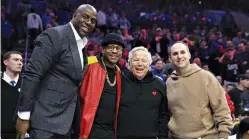  ?? BILL STREICHER-USA TODAY SPORT ?? (LEFT-RIGHT) NBA GREATS Magic Johnson, Allen Iverson, New England Patriots owner Robert Kraft, and Philadelph­ia 76ers co owner Michael Rubin pose for a photo during the second quarter against the Los Angeles Lakers at Wells Fargo Center.