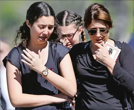  ?? BRYNN ANDERSON/AP PHOTO ?? Mourners weep as they leave a funeral service for shooting victim Alyssa Alhadeff at the Star of David Funeral Chapel in North Lauderdale, Fla., on Friday. Nikolas Cruz, a former student, was charged with 17 counts of premeditat­ed murder on Thursday.