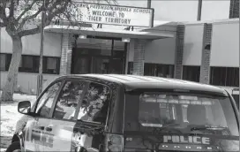  ?? Herald photo by Ian Martens @IMartensHe­rald ?? A police vehicle sits in front of Gilbert Paterson Middle School Friday morning after an apparent threat had school officials close the school for the day as police investigat­ed.