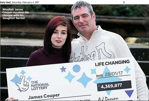  ??  ?? Windfall: James Couper receives his cheque with his daughter Rachel
