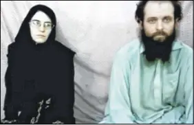  ?? CP PHOTO ?? This still image made from a 2013 video released by the Coleman family shows Caitlan Coleman and her husband, Canadian Joshua Boyle in a militant video given to the family. The American woman, her Canadian husband and their three young children have...