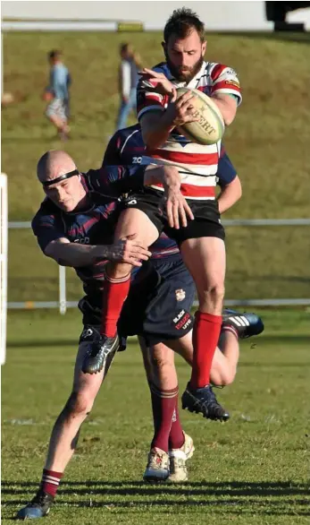  ?? PHOTO: BEV LACEY ?? BACK ON DECK: Toowoomba Rangers halfback Brad Rigby is tackled by Will Jackson of Bears in their Risdon Cup match at Gold Park last month. Rigby returns to the Rangers’ line-up for today’s qualifying semi-final showdown against Goondiwind­i at Riddles...