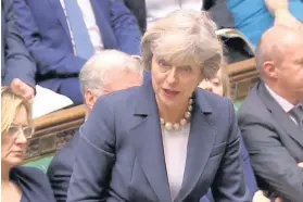 ??  ?? > Theresa May during Prime Minister’s Questions this week