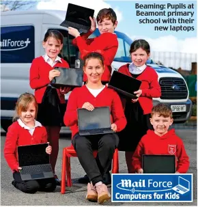  ??  ?? Beaming: Pupils at Beamont primary school with their new laptops