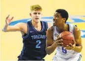  ?? ASHLEY LANDIS AP ?? Toreros guard Joey Calcaterra, here against UCLA, is averaging 15.5 points per game in four games.