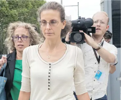  ?? MARY ALTAFFER / THE ASSOCIATED PRESS ?? Clare Bronfman, centre, leaves Federal court in New York with her attorney Susan Necheles, left, earlier this week. The heiress faces criminal charges in connection with her role in a slave-master cult run by Keith Raniere.