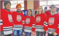  ?? DAVID JALA/CAPE BRETON POST ?? This group of Hometown Hockey festival goers included three university students from India, all who admitted they have yet to see a live hockey game. From left are Tegeshwan Singh, Harpreet Singh, Amandeep Kaur, Lainie MacNeil of Sydney, and Albert Francis, formerly of Newfoundla­nd.