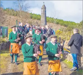  ?? ?? Members of the Eamon Bulfin Pipe Band marching from the Liam Lynch Memorial Monument.