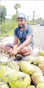  ?? Picture: VILIAME RAVAI ?? Eparama Tawayaga of Wailoku sells green coconuts along Princes Rd in Tamavua yesterday.