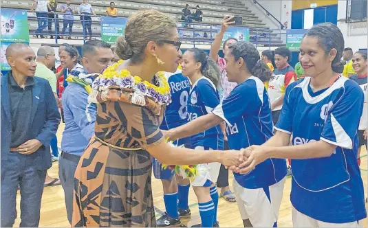  ?? Picture: SOPHIE RALULU ?? Motibhai futsal player Ragigia greets Minister for Women Lynda Tabuya during the launch of the Bula House Futsal Soccer Competitio­n at the FMF Gymnasium in Suva on Tuesday night.